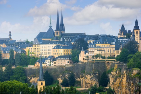 View of Luxembourg Old Town, with the two towers of the Notre Dame Cathedral in the background, and the tower of the abbey church Saint Johann in the foreground